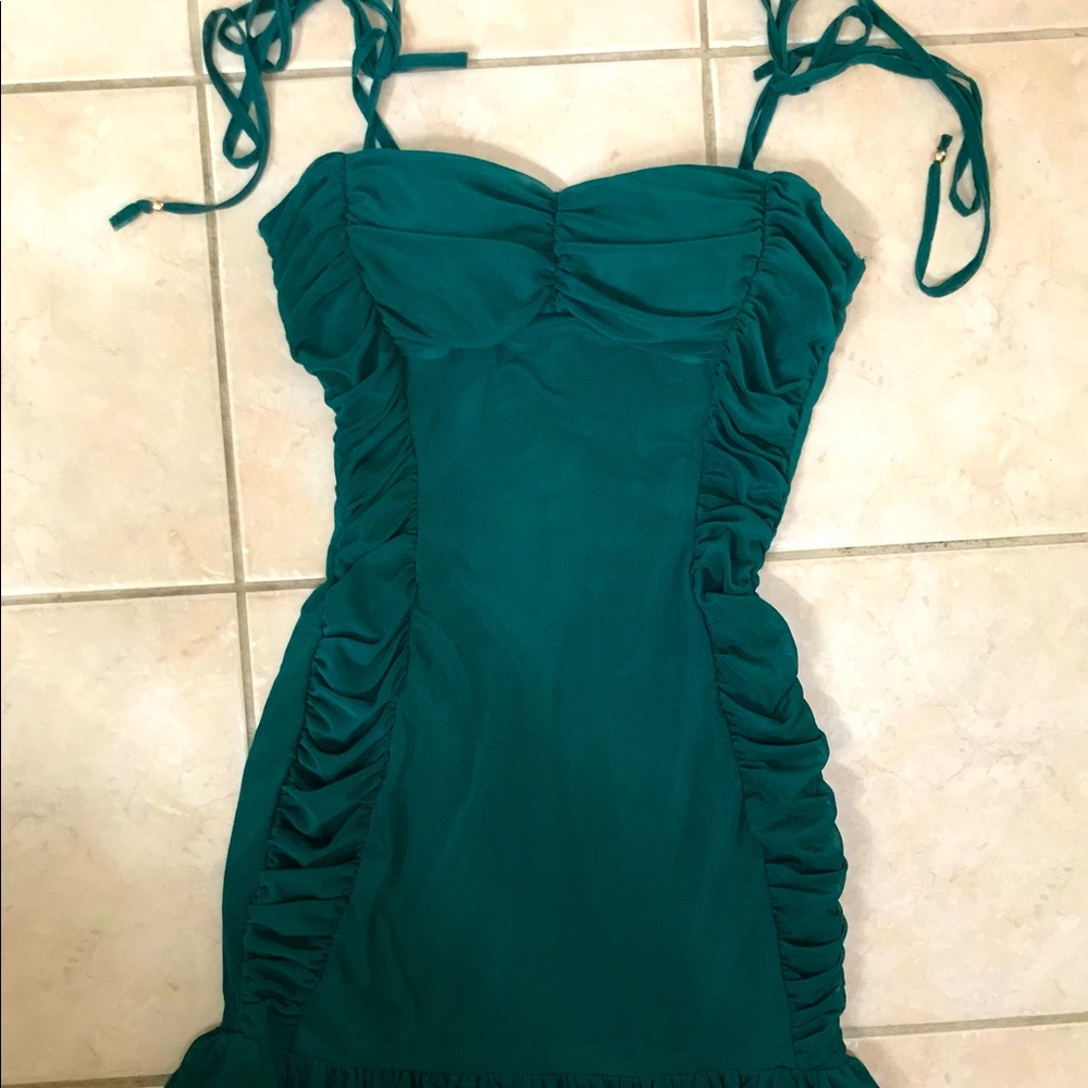 Emerald green ruched ruffle hem dress